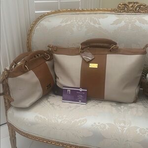 Designer, two piece, leather tan, and beige luggage.